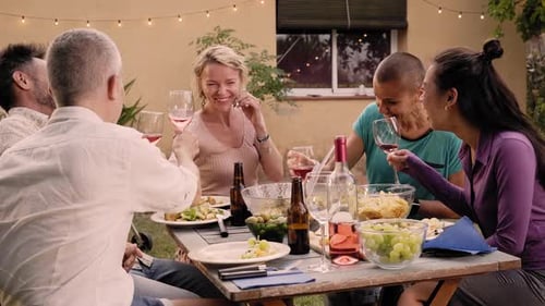 Happy Friends Having Fun Outdoors Enjoying Being Together at Home Garden