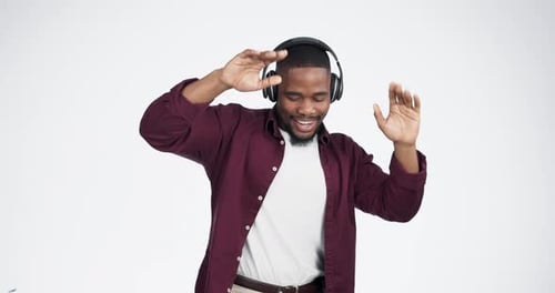 Headphones, music and man face dance in studio celebration with news, feedback