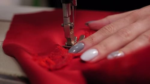 Closeup Seamstress Hands Working on Sewing Machine