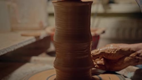 Close Up Potter Makes a Pot on the Spinning Pottery Wheel Professional Craftsman Create Pitcher Out