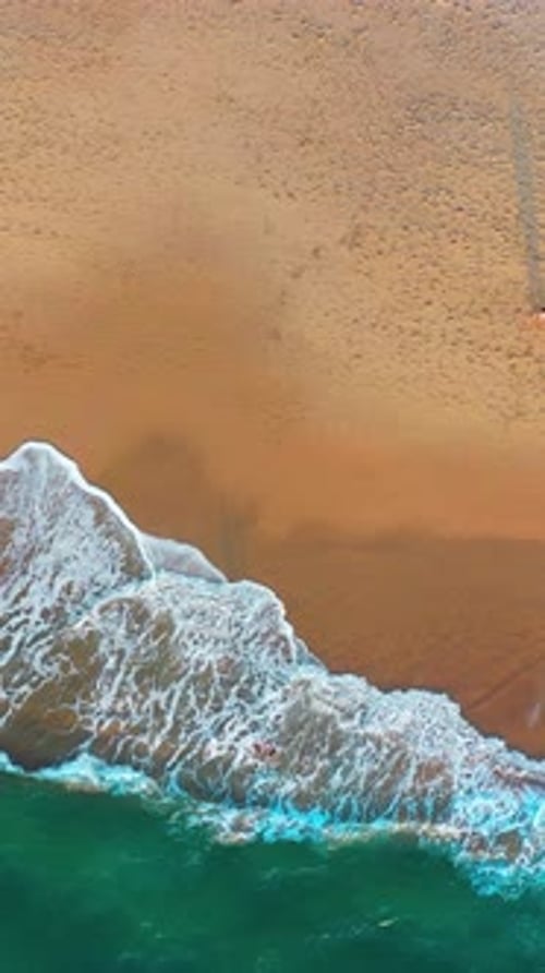 Exploring the Serene Beach Shoreline With Gentle Waves and Golden Sand at Sunset
