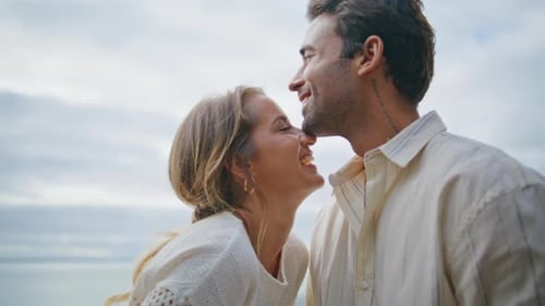 Laughing Sweethearts Having Fun Ocean View Terrace Closeup Macho Kissing Woman