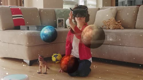 Child with VR Headset Interacts with Virtual Planets