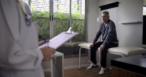 Doctor Consults with Patient in Modern Clinic Room