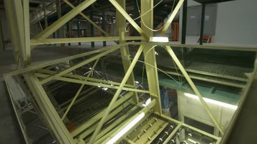 Camera Shows Chipboard Conveyor Frame in Workshop