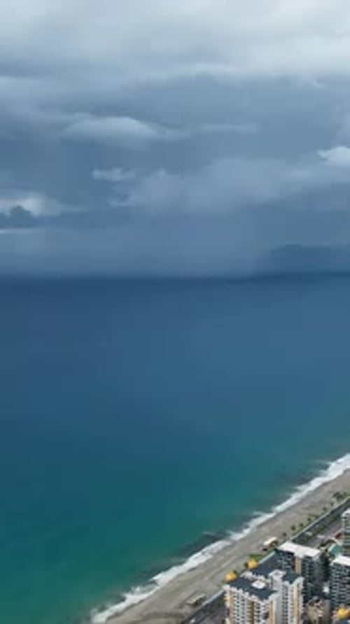 Vertical Video Coastal Turmoil Aerial View of Stormy Mediterranean Coastline and City Panorama with