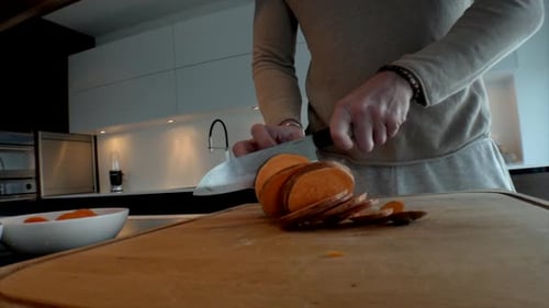 4k camera footage. Cooking vegetables. Eating healthy at home. Chopping and cooking carrot, zucchini