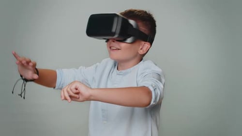 Boy Experiences Virtual Reality With Headset