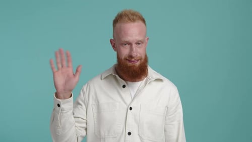 Red Haired Man Waving Hello on Blue Background