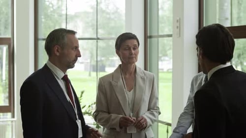 Diverse Business Professionals Discussing in Office