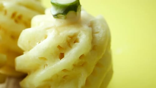 Slice of Pineapple on Yellow Background