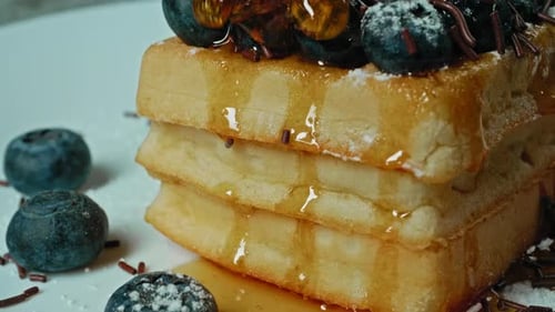 Syrup Drizzled on Waffles with Blueberries