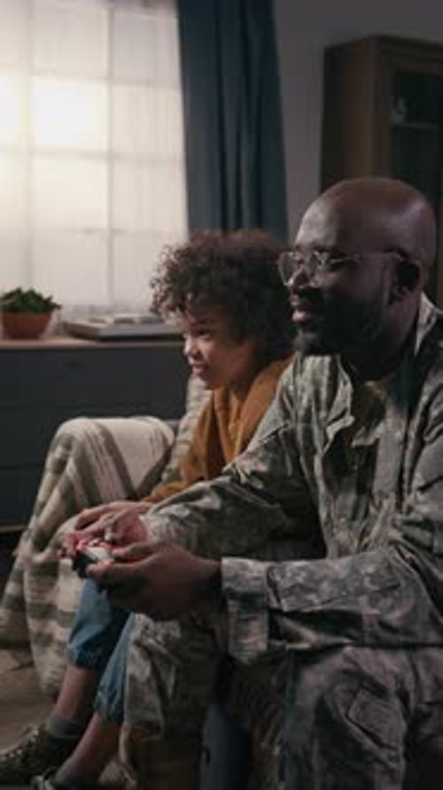 Child and Adult Play Video Games at Home