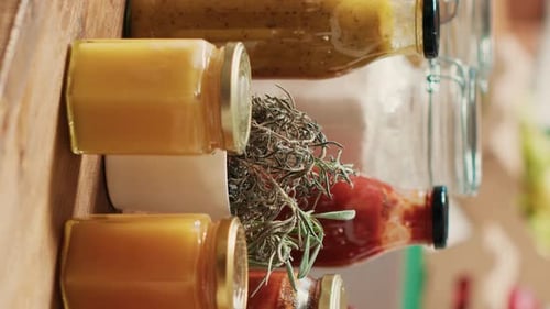 Close up of Jars of Preserves and Herbs
