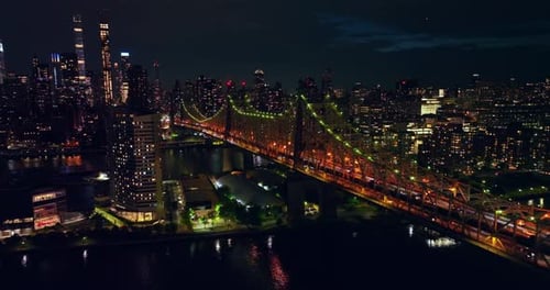Gorgeous Ed Koch Queensboro Bridge with green and orange backlight.