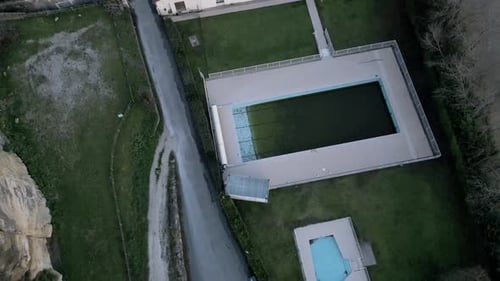 Desolate Aerial View of Abandoned Pool