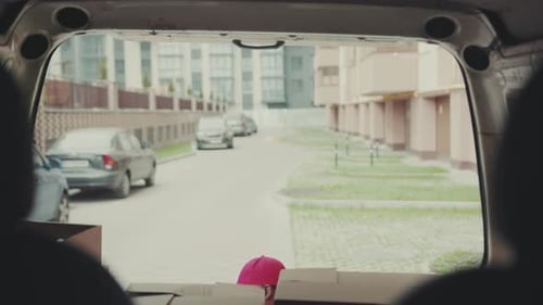 Face Courier Young African American Man Put the Boxes in the Car Carries Delivery Business Postal