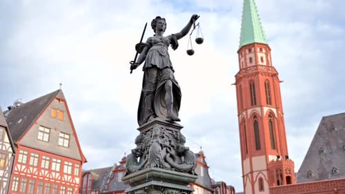 Justice fountain square statue and buildings in Frankfurt, Germany