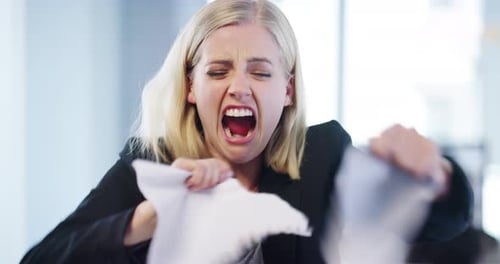 Angry, stress and screaming business woman ripping paper or documents in frustration