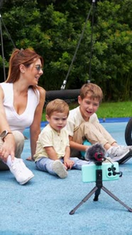 Mother and Children Vlogging in Playground