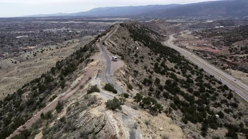 Drone Shot of Campervan on Scenic Rocky Hilltop Road