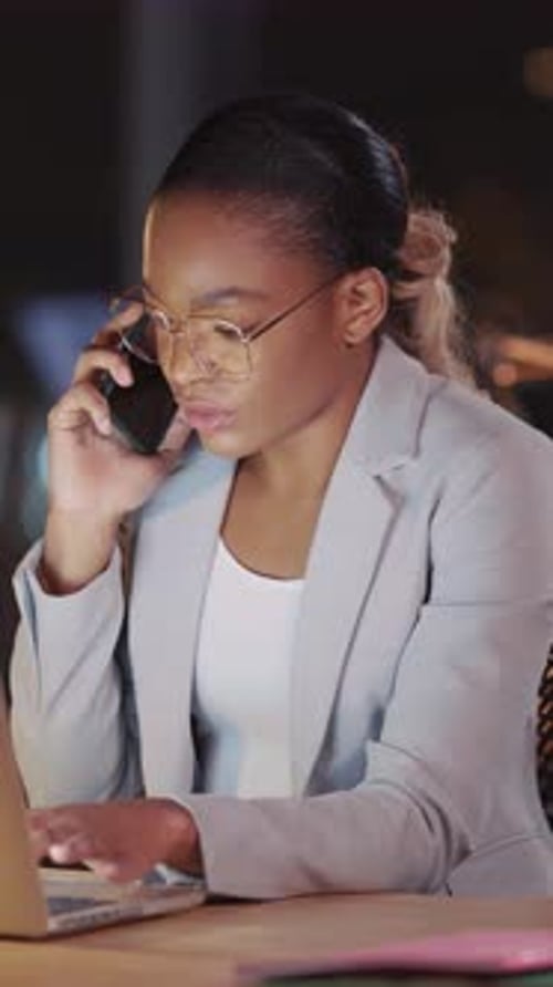 Woman Working Late on Phone and Laptop