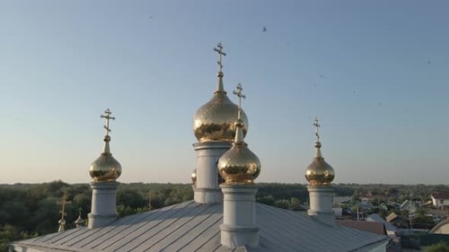 Bell Tower of Church with Christian Cross on Background of Clear Sky