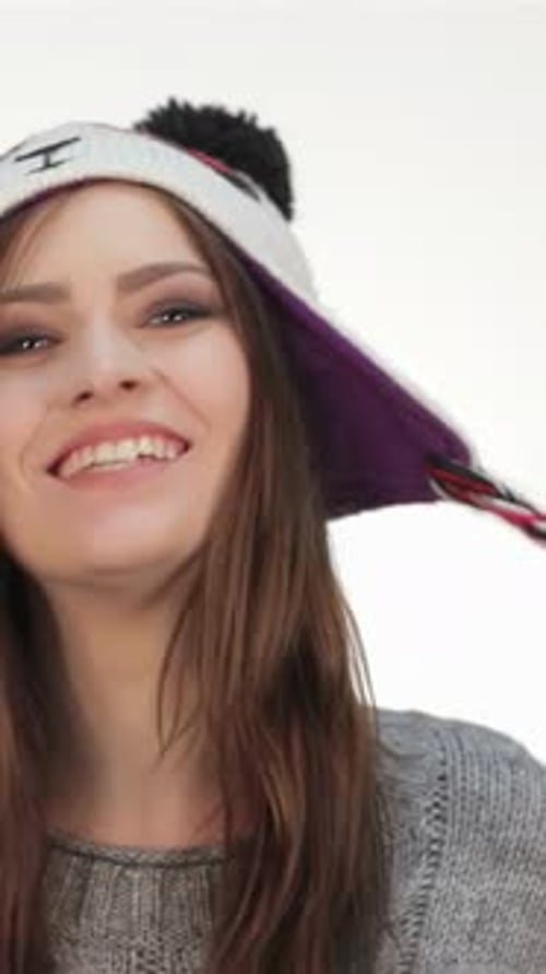 Cheerful Woman Modeling a Panda Winter Hat