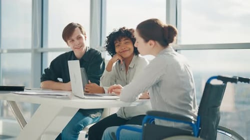 Young Business Woman Sitting Wheelchair While Work Young Business People Working in Office Workplace