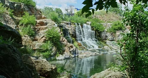 a Beautiful Mountain Waterfall Flows Through the Rocks Its Water Washes Stones and Trees