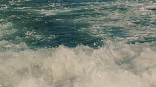 Closeup Seething Wake with Foam and Spray From Boat Motor Turbulent Flow From Watercraft's Engine on