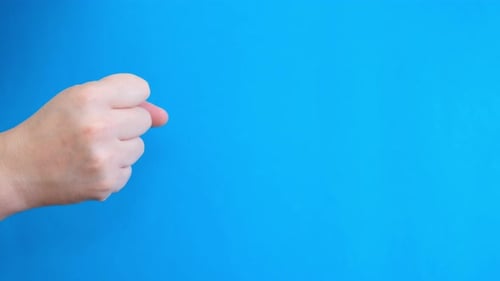 Man Counting with Fingers on Chromakey Background with Blue Background