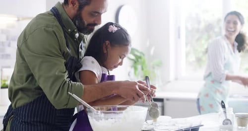 4k video footage of a family of three baking at home