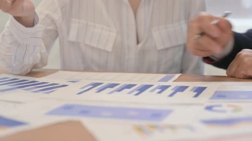 Business People Working on Documents in Office