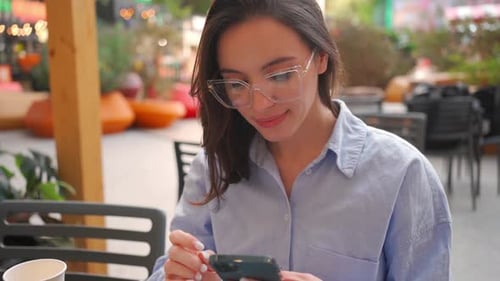 Woman Using Smartphone Sitting Cafe