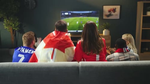 Canadian football fans watching match at home