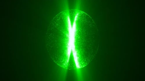A green luminous orb sphere floating in darkness, dotted with light specks and radiating