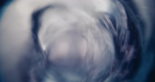 Top View on Magnetic Mixer Spinning and Mixing Fluid Materials in Glass Flask