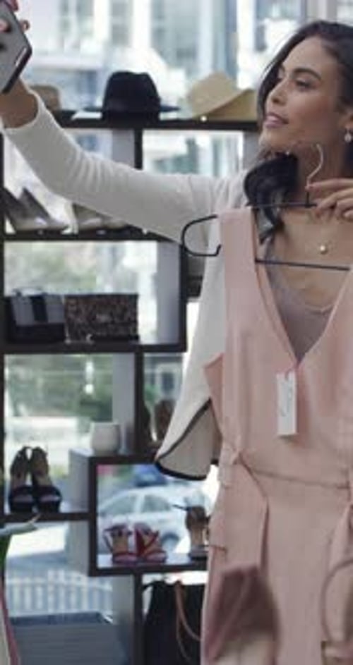 Clothing rack, selfie and shopping with woman in store for choice, outfit selection or variety