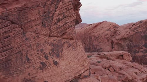 Drone flies through red sandstones and reveals the beautiful landscape and valley of fire in Nevada