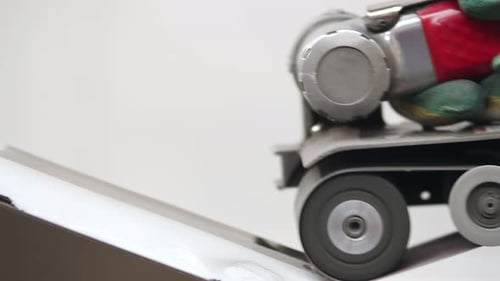 Closeup of a Worker Wearing Gloves Grinding the Surface of a Part with a Special Metal Grinder on a
