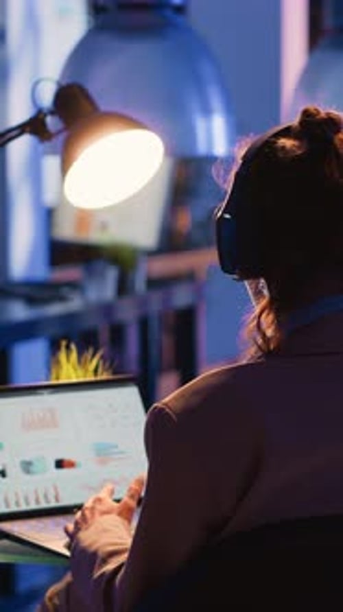 Vertical Video Focused Employee Analyzing Financial Graphs