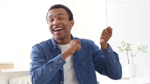 AfroAmerican Man Dancing in Office