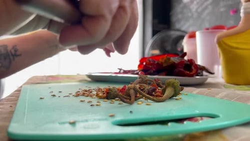 Preparing Dried Red Peppers in Kitchen