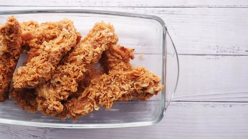 Crispy Fried Chicken Tenders in a Glass Dish