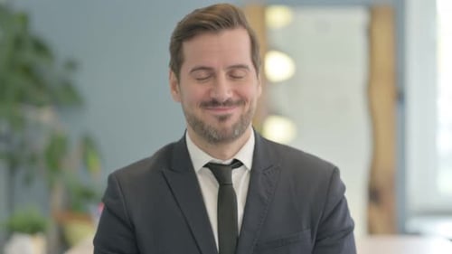 Man in Suit Smiles at Camera