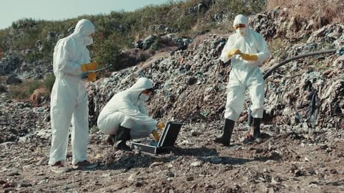 Scientists Study the Landfill in Protective Suits