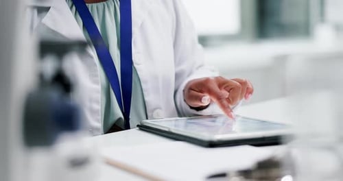 Adult Scientist Working with Tablet in Lab