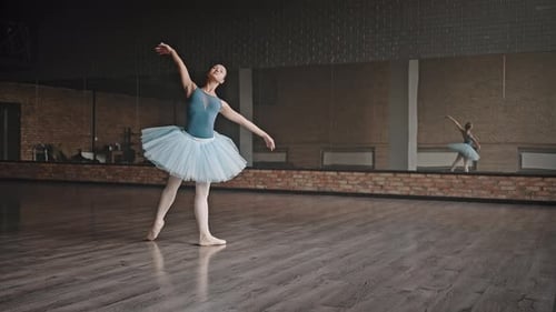 Elegant Ballerina Practicing Ballet in a Dance Studio