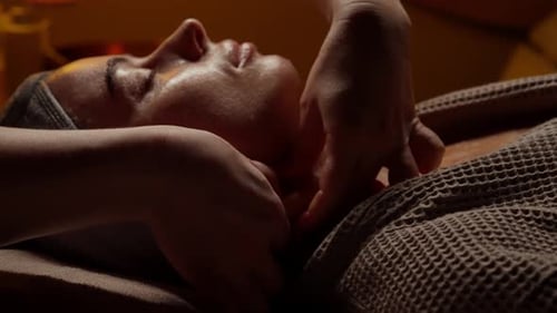 Closeup Tranquil Spa Therapy Session with Relaxing Neck and Shoulder Massage on Serene Woman Lying